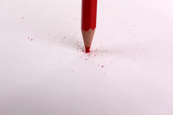 Breaking pencil on paper, close up — Stock Photo, Image