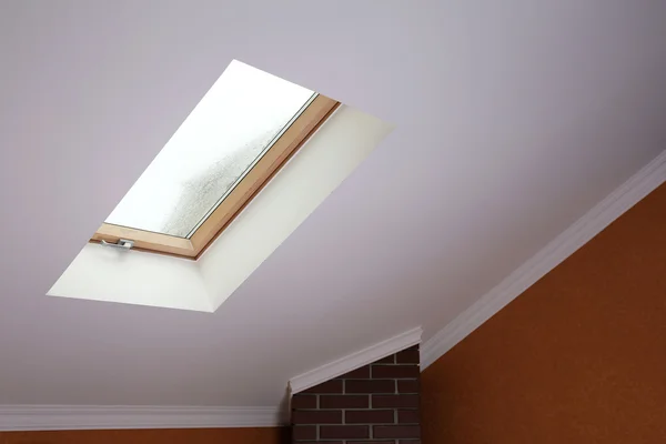 Roof skylight in new modern attic room — Stock Photo, Image