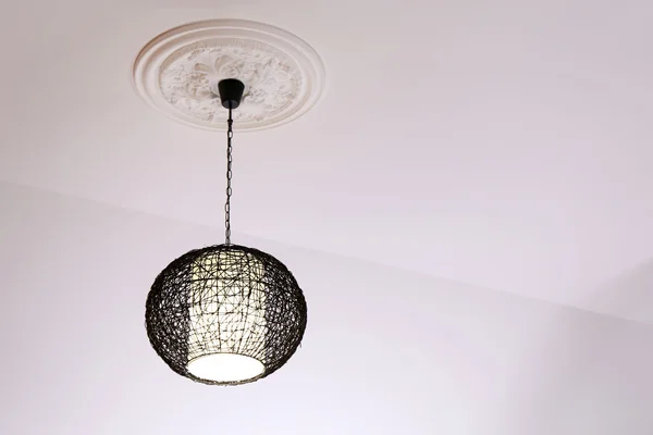 Modern chandelier hanging from ceiling — Stock Photo, Image