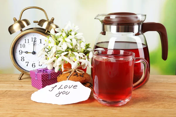 Tasty herbal tea and cookies on wooden table — Stock Photo, Image