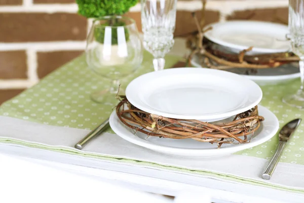 Beautiful holiday Easter table setting in green tones, on bright background — Stock Photo, Image