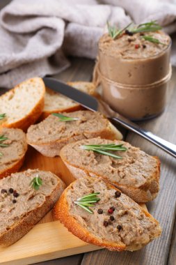 Fresh pate with bread on wooden table clipart