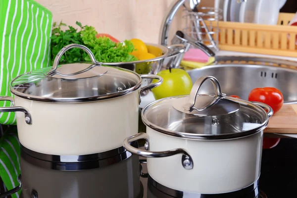 Pots on stove in kitchen — Stock Photo, Image