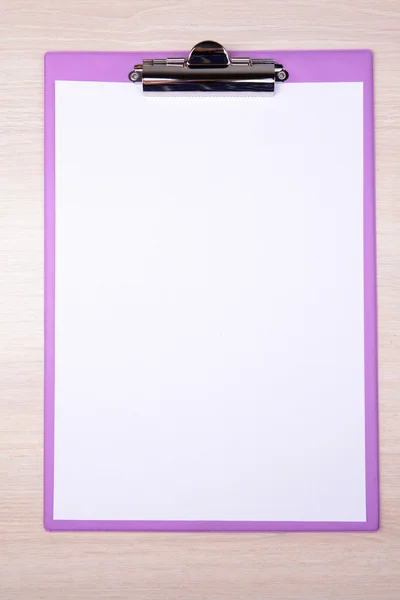 Clipboard on wooden background — Stock Photo, Image