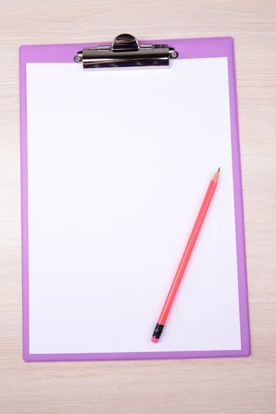 Clipboard on wooden background — Stock Photo, Image