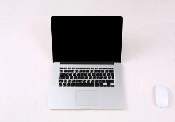 Office workplace with open laptop on wooden desk — Stock Photo, Image