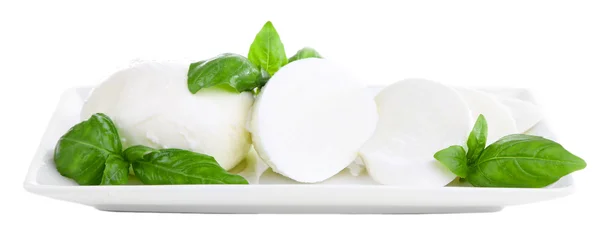 Tasty mozzarella cheese with basil on plate isolated on white — Stock Photo, Image