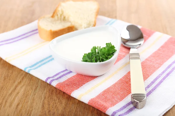 Bowl of creamy soup on wooden table — Stock Photo, Image