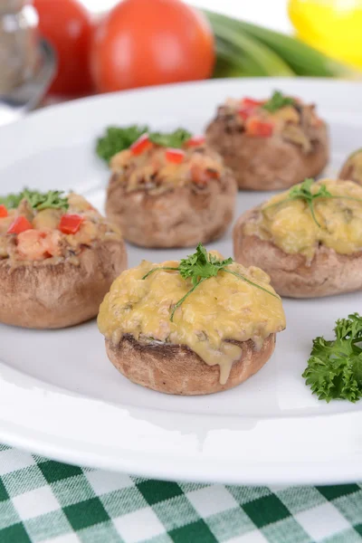 Stuffed mushrooms on plate on table close-up — Stock Photo, Image