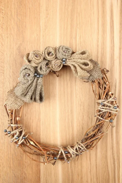 Beautiful rustic wreath, on wooden background — Stock Photo, Image