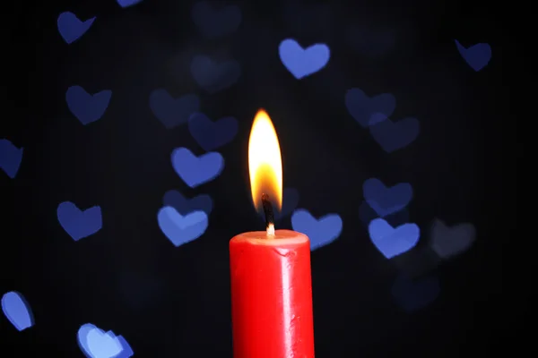 Burning candle on beautiful bokeh background — Stock Photo, Image