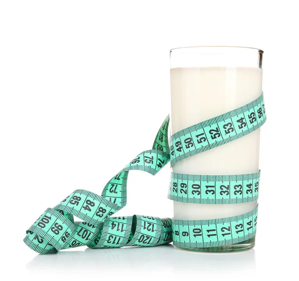 Glass of milk with measuring tape isolated on white — Stock Photo, Image