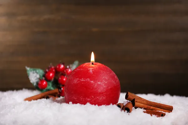 Burning candle on wooden background — Stock Photo, Image