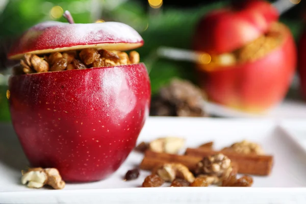 Stuffed Christmas apples with nuts and raisins on table close up — Stock Photo, Image