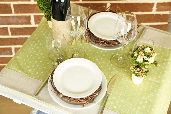 Beautiful holiday Easter table setting in green tones, on bright background — Stock Photo, Image