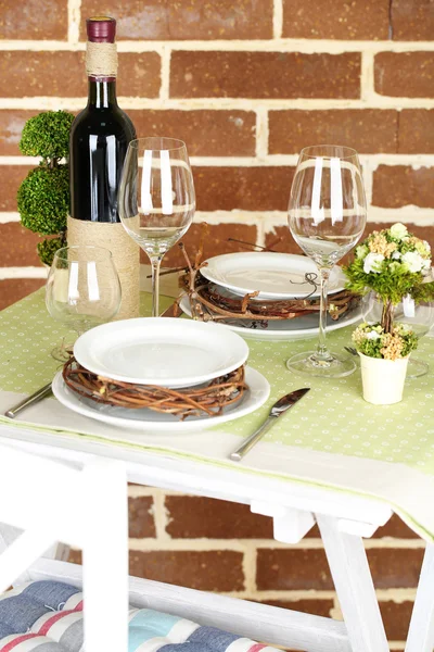 Beautiful holiday Easter table setting in green tones, on bright background — Stock Photo, Image