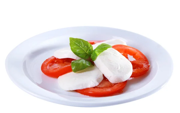 Salada Caprese com queijo mozarella, tomate e manjericão em prato, isolado em branco — Fotografia de Stock