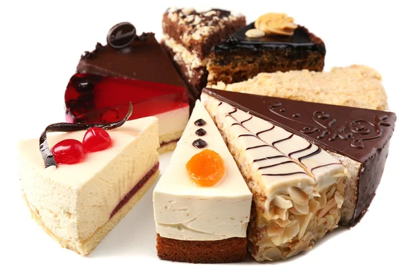 Assortiment van stukken van cake, geïsoleerd op wit — Stockfoto