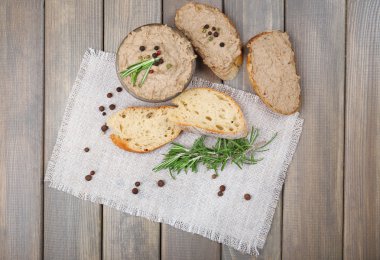 Fresh pate with bread on wooden table clipart