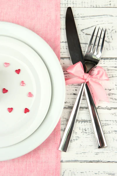 Romantic holiday table setting, on wooden background — Stock Photo, Image