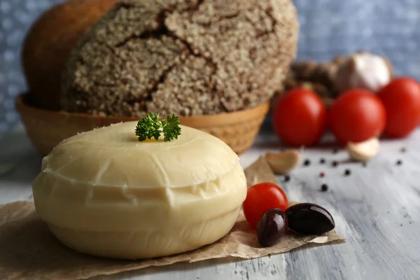 Tasty Italian cheese on wooden table — Stock Photo, Image