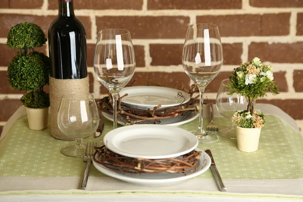 Beautiful holiday Easter table setting in green tones, on bright background — Stock Photo, Image