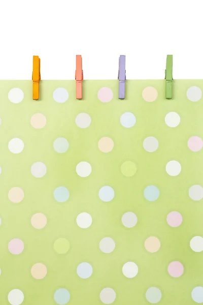 Abstracte achtergrond met kleurrijke houten pinnen en papier — Stockfoto