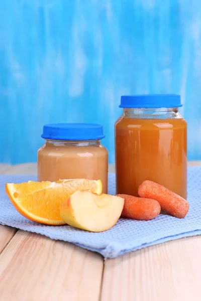 Jars  of various baby food, on wooden background — Stock Photo, Image