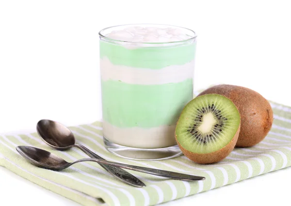 Heerlijke yoghurt met fruitsmaak in glas op servet, geïsoleerd op wit — Stockfoto
