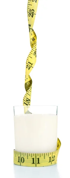 Glass of milk with measuring tape isolated on white — Stock Photo, Image