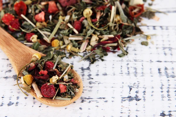 Aromatic dry tea on wooden background — Stock Photo, Image