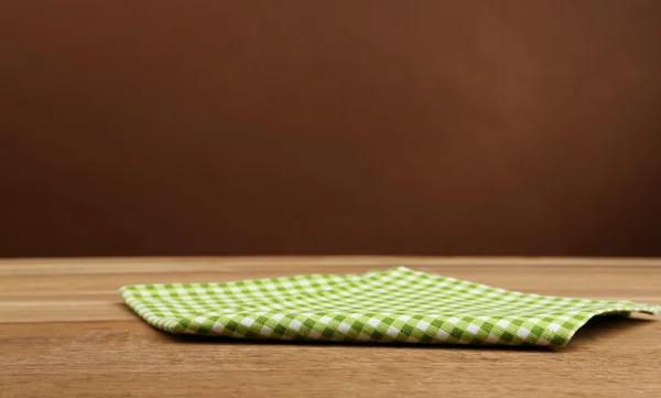 Arrière-plan avec table et nappe en bois — Photo