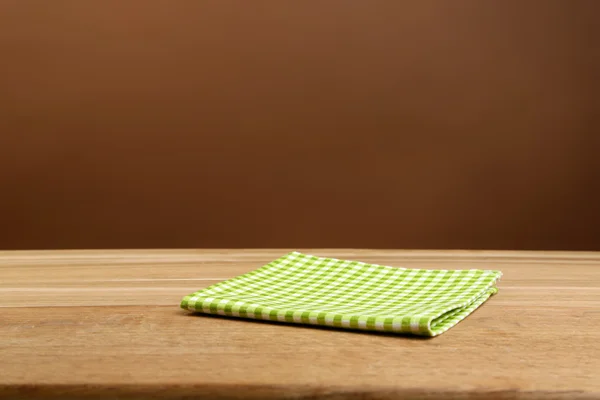 Bakgrund med träbord och duk — Stockfoto