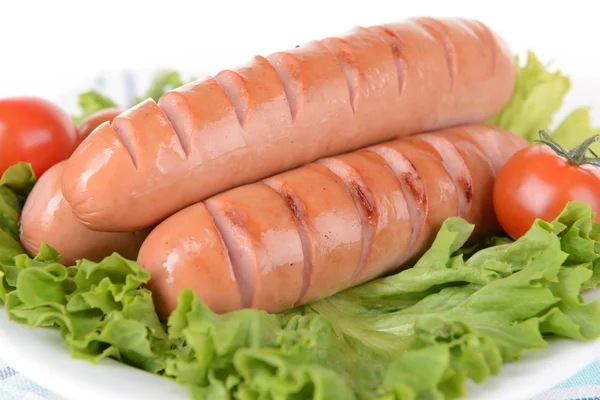 Grilled sausage on plate on table close-up — Stock Photo, Image