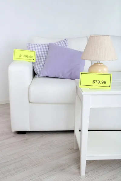 New white furniture with prices on light background — Stock Photo, Image