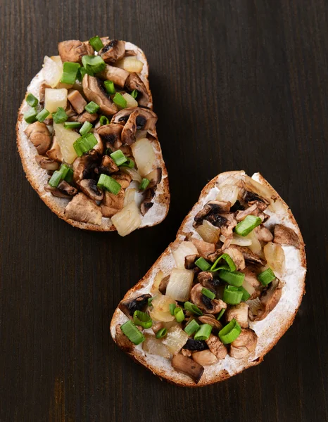 Delicious bruschetta with mushrooms on table close-up — Stock Photo, Image