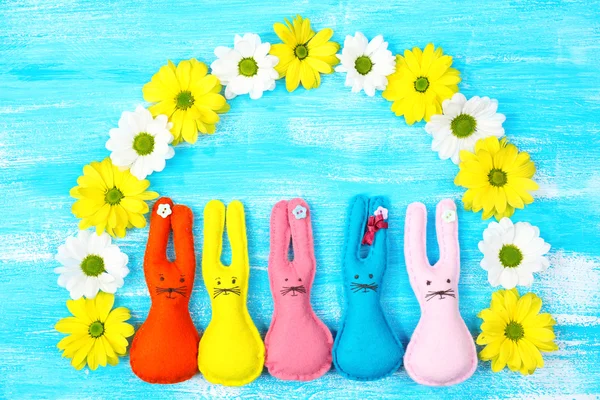 Composition with funny handmade Easter rabbits on wooden background — Stock Photo, Image