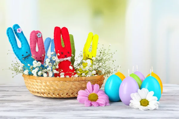 Funny handmade Easter rabbits in wicker basket — Stock Photo, Image