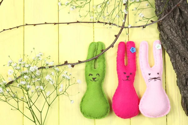 Composition with funny handmade Easter rabbits on wooden background — Stock Photo, Image