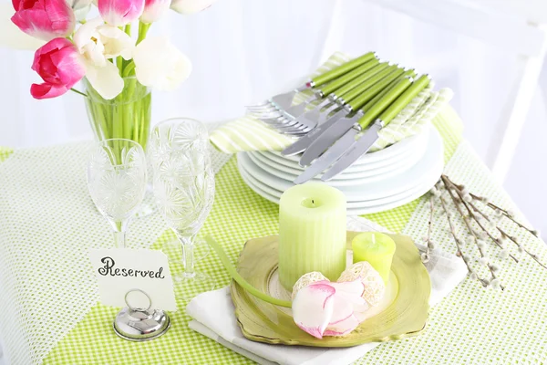 Composition with plates and cutlery on table, on light background — Stock Photo, Image