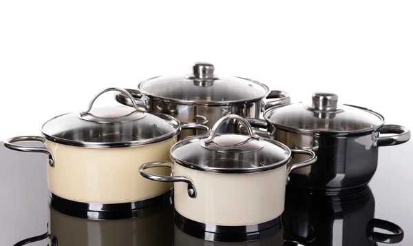 Pans on table on white background — Stock Photo, Image