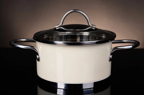 Pan on table on brown background — Stock Photo, Image