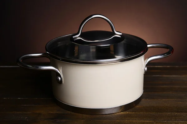 Pan on table on brown background — Stock Photo, Image