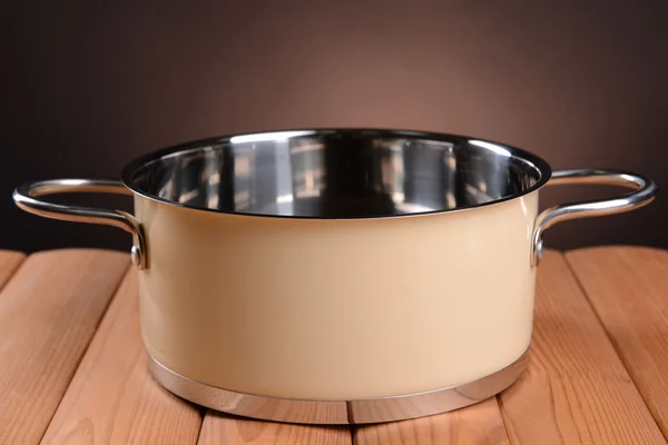 Pan on table on brown background — Stock Photo, Image