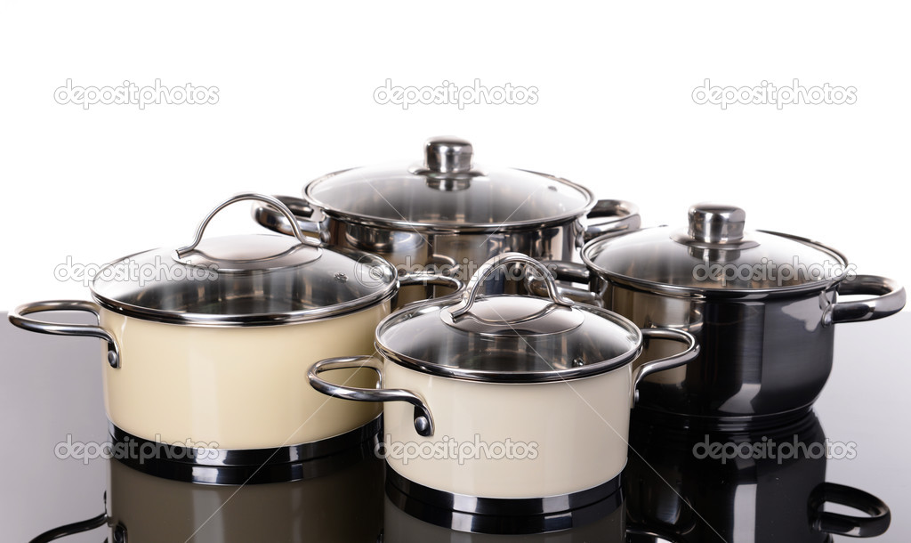 Pans on table on white background