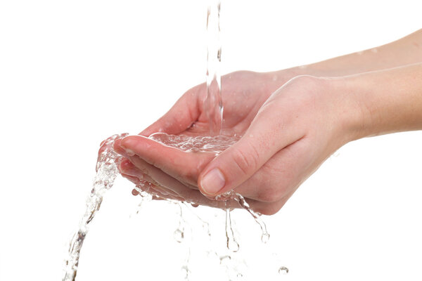 Human hands with water splashing on them isolated on white