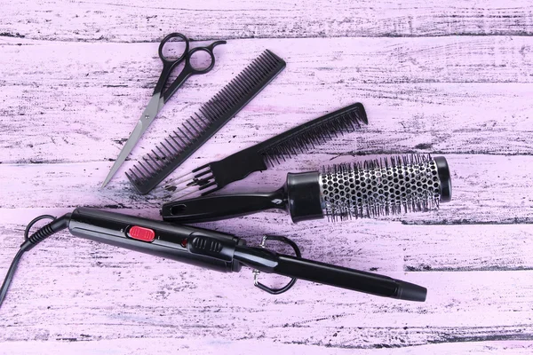 Professional hairdresser tools on color wooden background — Stock Photo, Image