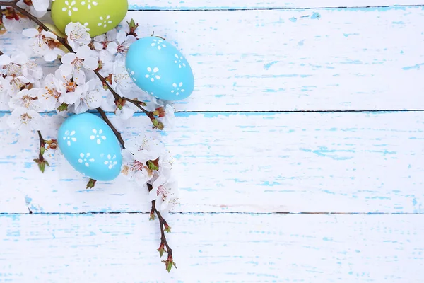 Easter composition with flowering branches on wooden table close-up — Stock Photo, Image