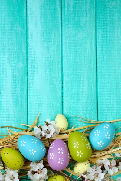 Easter composition with flowering branches on wooden table close-up — Stock Photo, Image