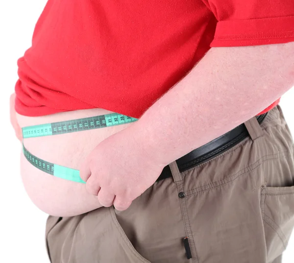 Gordo sosteniendo cinta métrica. Foto conceptual de la pérdida de peso. Aislado sobre blanco — Foto de Stock